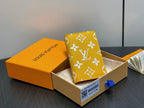 Small bag with yellow monogram pattern and white flowers on a foldover flap