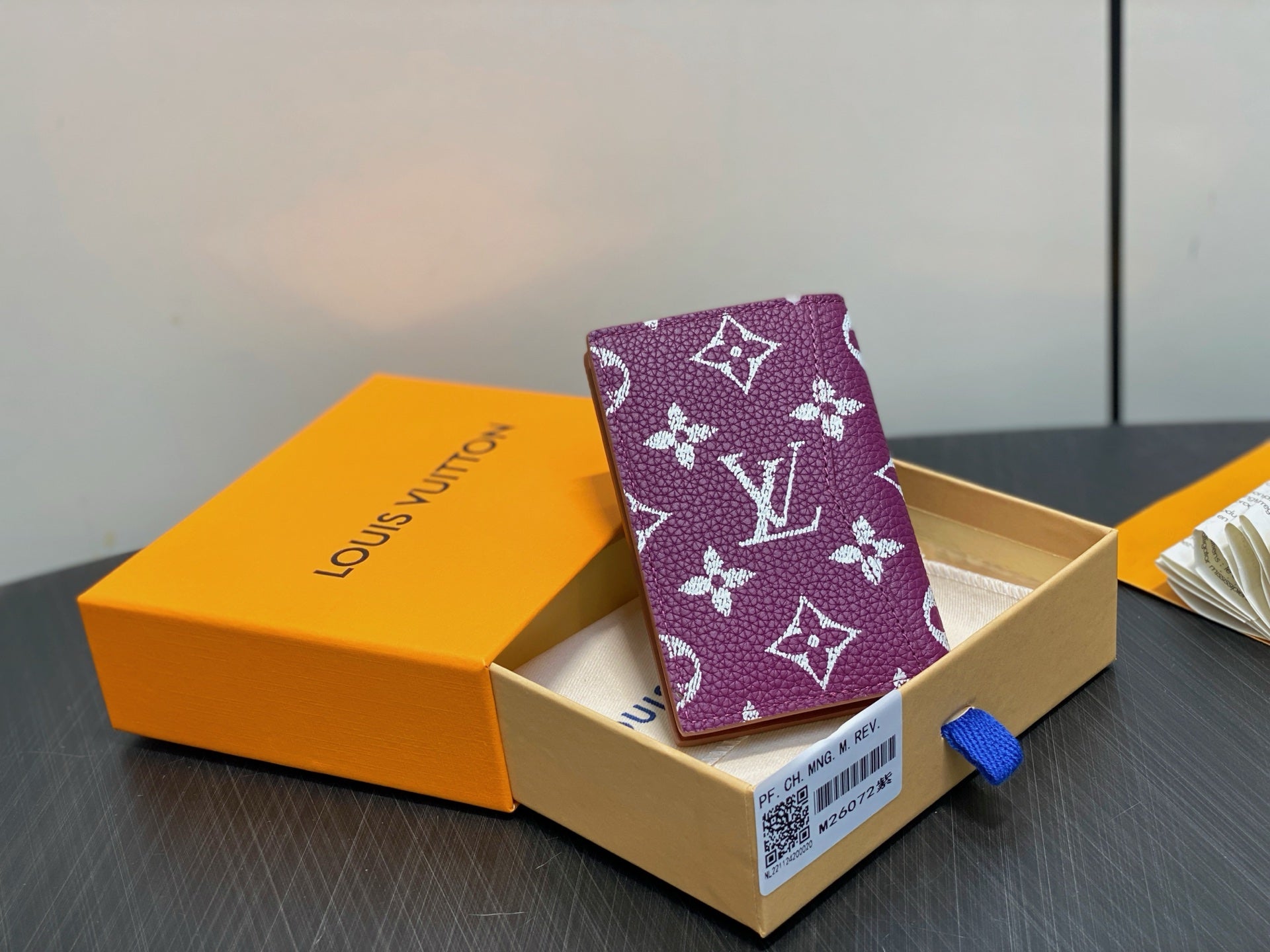 Purple small bag with white LV monogram pattern, inside cardboard gift box