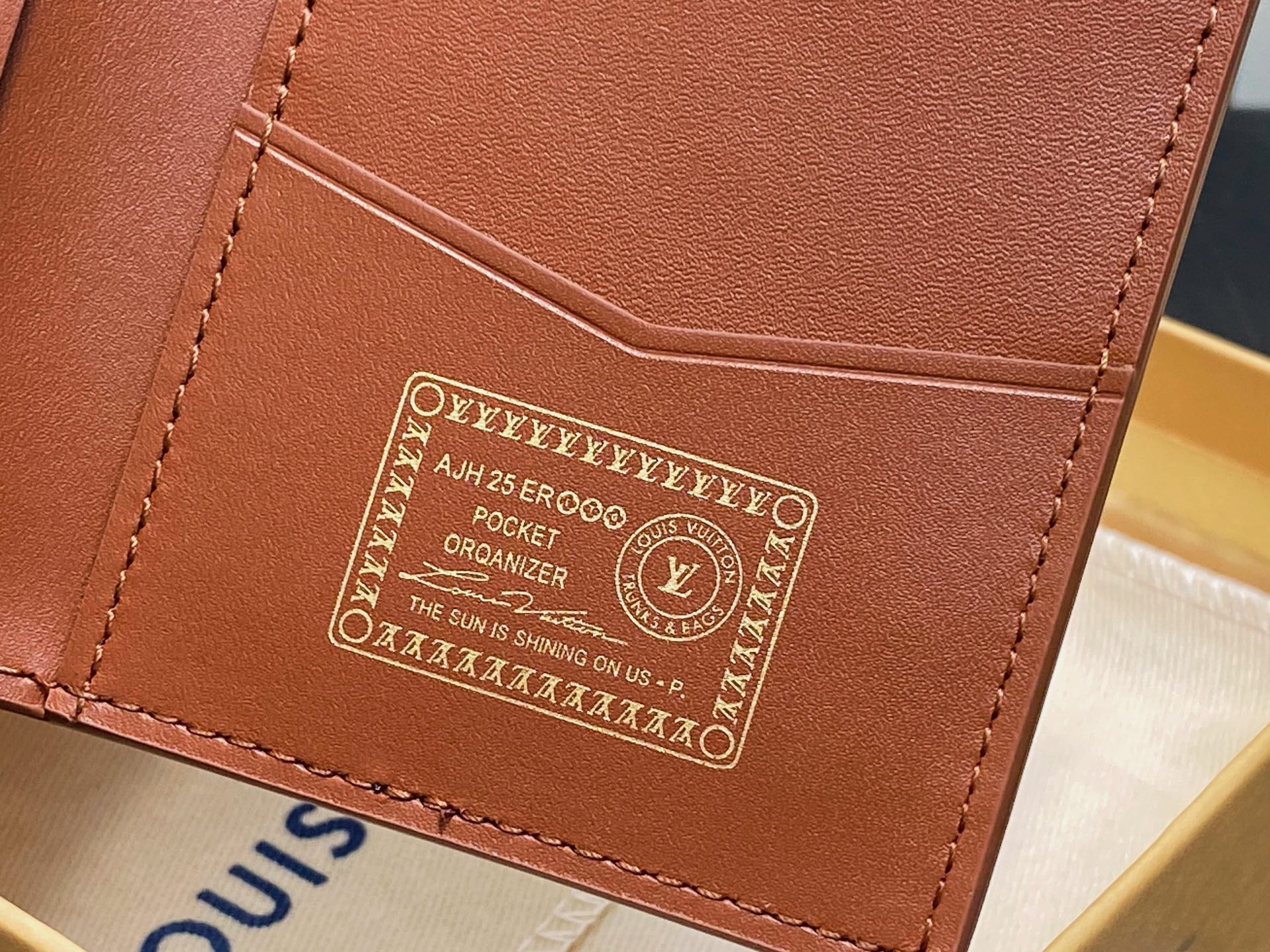 Brown leather small bag with engraved organizer label, card slot view