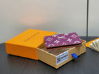 Purple small bag with LV monogram pattern, partially folded in gift box
