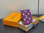 Purple small bag with white monogram flowers, open gift box packaging