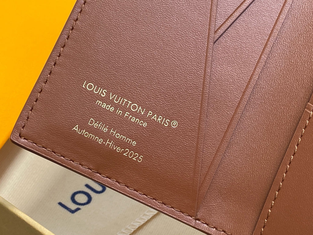Brown mini wallet panel with Louis Vuitton Paris text and made in France, close-up