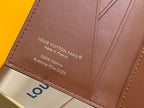 Brown mini wallet panel with Louis Vuitton Paris text and made in France, close-up