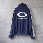Navy zip-up track jacket with striped sleeves and large Balenciaga back logo