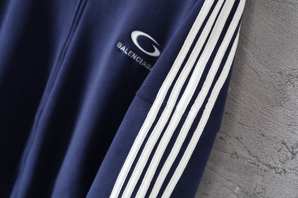 Navy jacket with white triple stripe sleeve trim