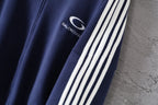 Navy jacket with white triple stripe sleeve trim
