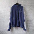Navy zip-up track jacket with striped sleeves and Balenciaga chest logo
