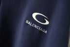 Navy jacket with Balenciaga oval logo and brand wordmark
