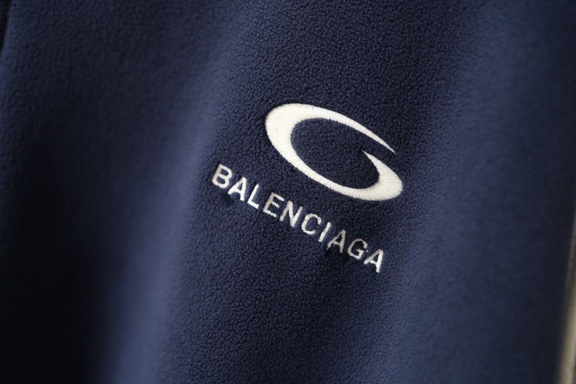 Navy jacket with Balenciaga oval logo and brand wordmark