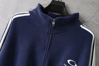 Navy zip-up jacket with high stand collar and striped shoulder accents