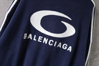 Navy jacket with large white Balenciaga logo on chest
