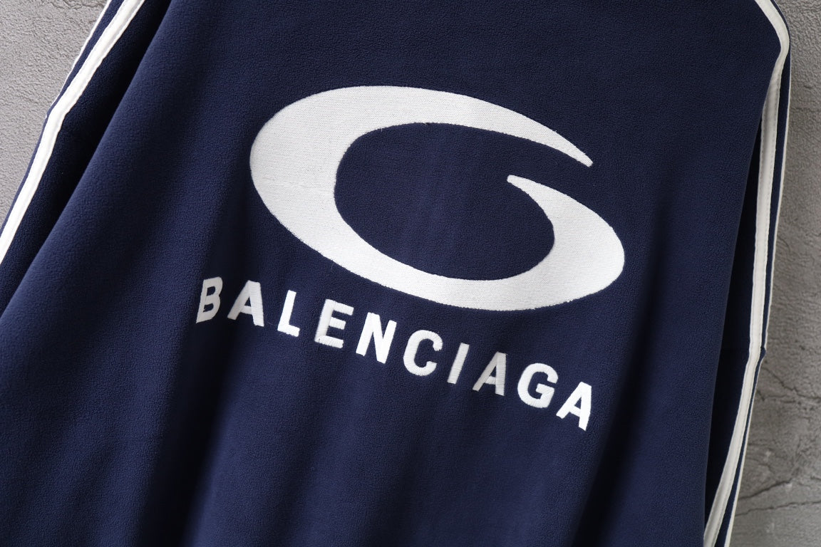 Navy jacket with large white Balenciaga logo on chest
