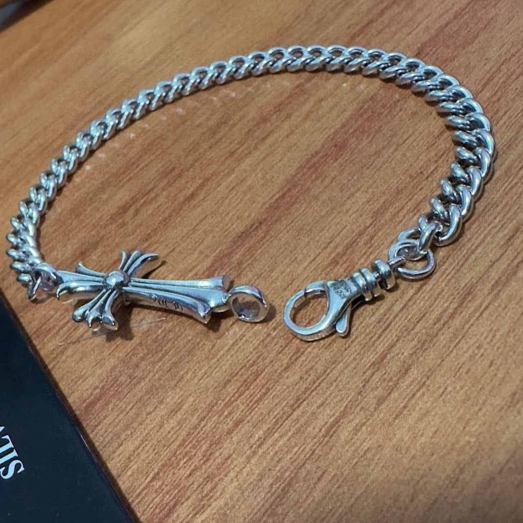 Silver-tone cross charm bracelet with chunky chain and ring clasp