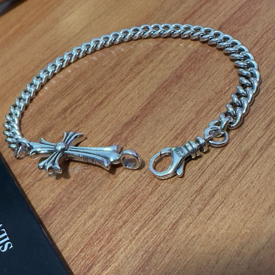 Silver-tone cross charm bracelet with chunky chain and ring clasp