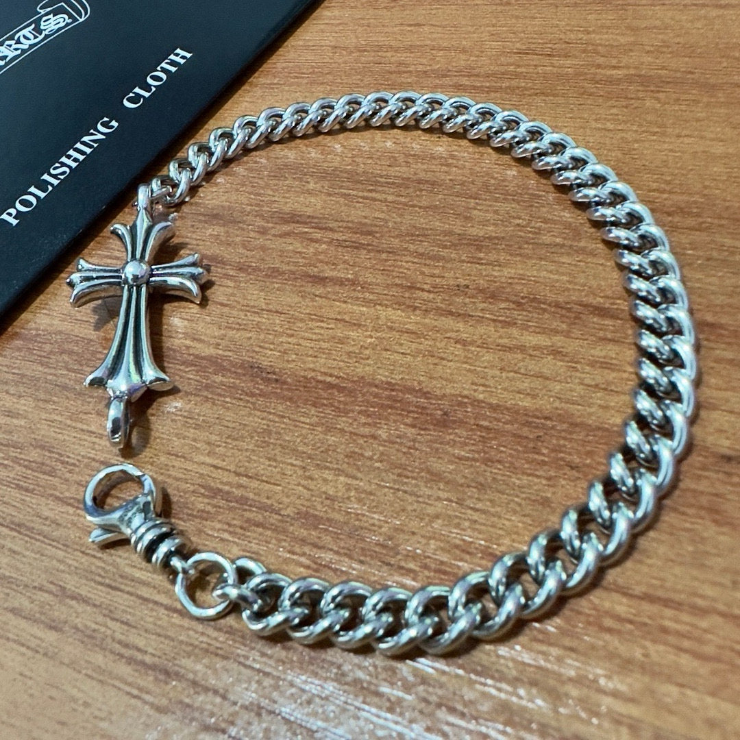 Silver-tone chain bracelet with cross pendant and ring clasp