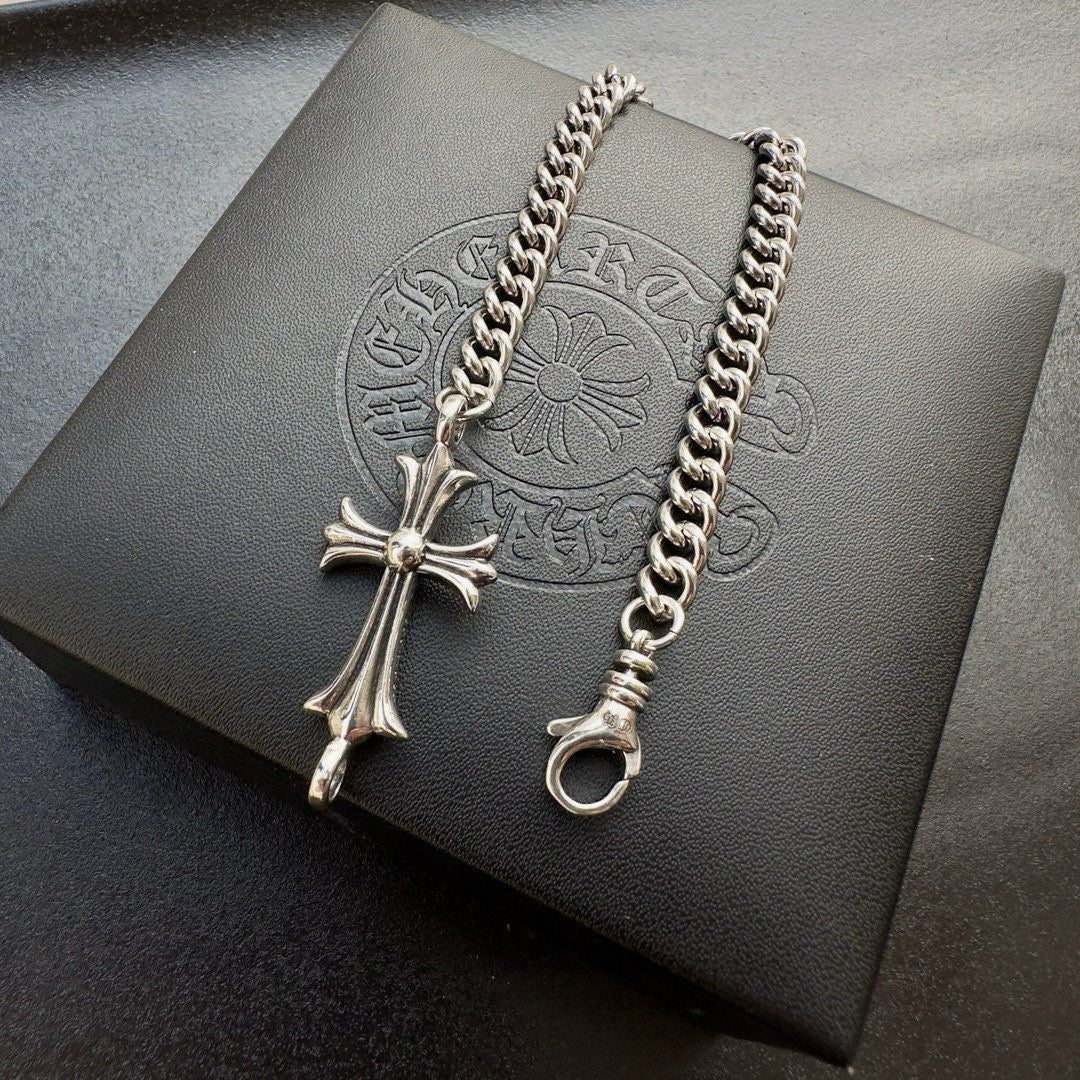 Silver-tone chain bracelet with cross pendant and ring clasp
