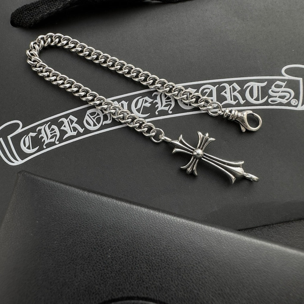 Silver-tone chain bracelet with cross charm and ring clasp