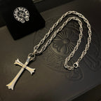 Silver-tone cross pendant necklace with round emblem on chain