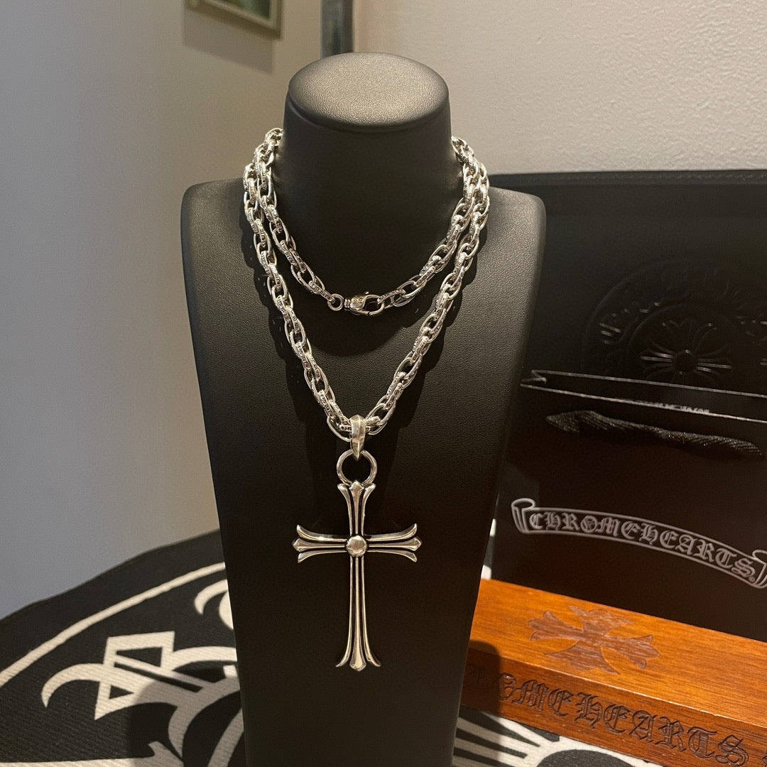 Silver-tone cross necklace on chain, front view with pendant detail