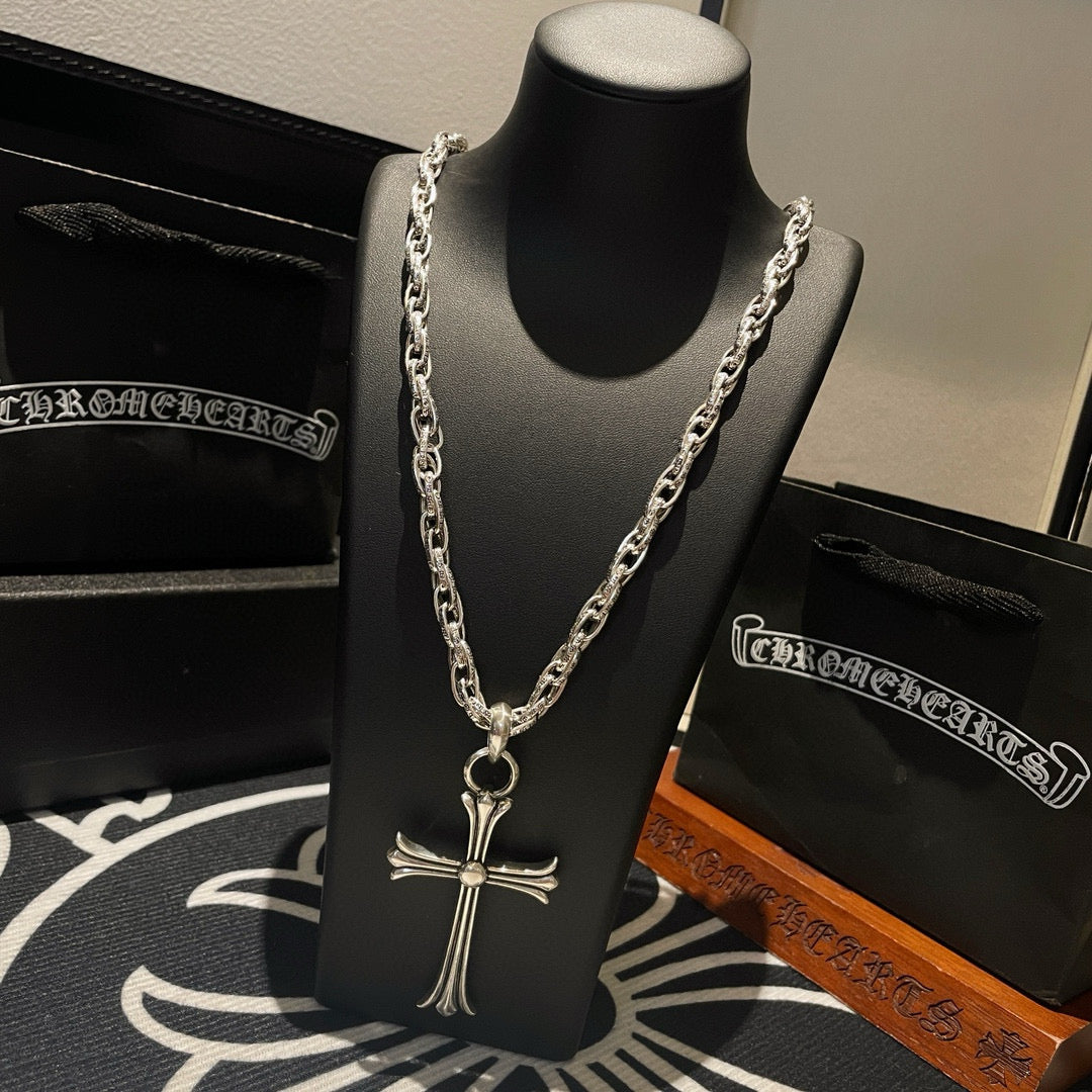 Silver-tone cross pendant necklace with layered chain links