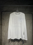 White long-sleeve shirt with small crest logo on upper right chest.