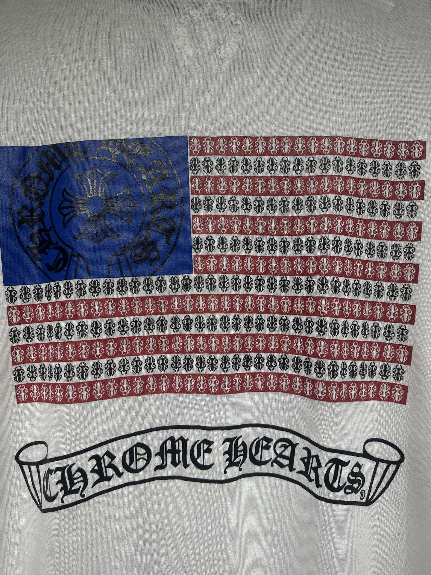 Long-sleeve graphic shirt in white with red and blue stripe pattern and front text logo