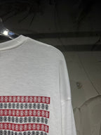 Long-sleeve graphic shirt sleeve with red and blue stripe band print near the shoulder