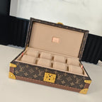Monogram travel bag with open lid and beige organizer compartments