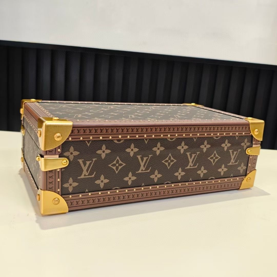 Louis Vuitton monogram trunk bag with gold trim and hardware, side angle, closed