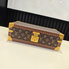 Louis Vuitton monogram trunk bag with gold hardware and corner locks, closed