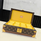Louis Vuitton monogram trunk bag with yellow interior and gold clasp, open view