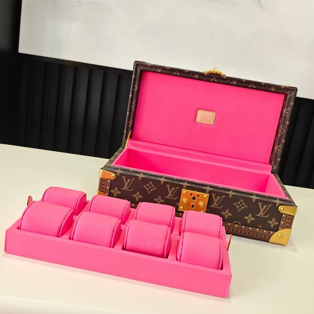 Louis Vuitton monogram trunk bag open with bright pink lining and padded insert