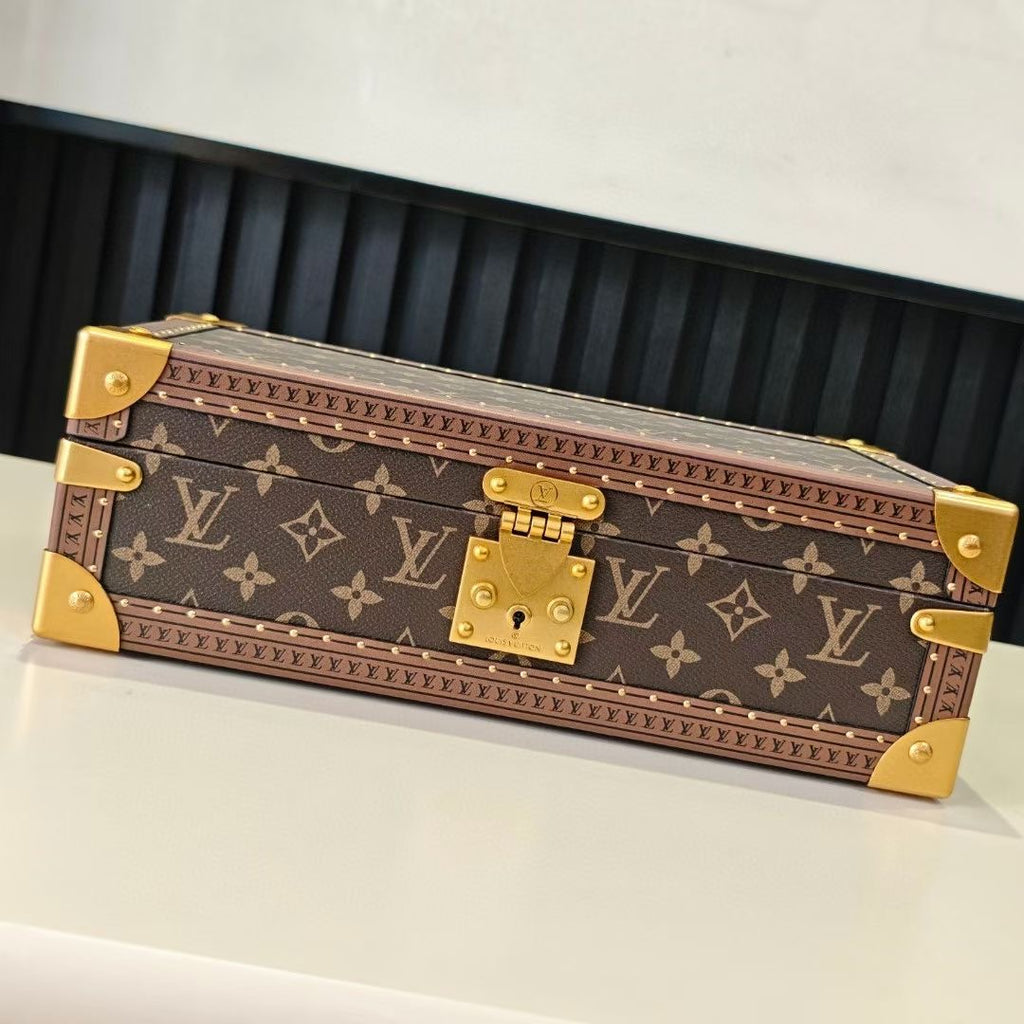 Louis Vuitton monogram trunk bag, closed, with gold corner hardware and front clasp