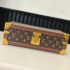 Louis Vuitton monogram trunk bag, closed, with gold corner hardware and front clasp