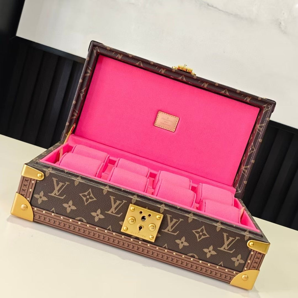 Louis Vuitton monogram trunk bag with bright pink interior compartments and open lid