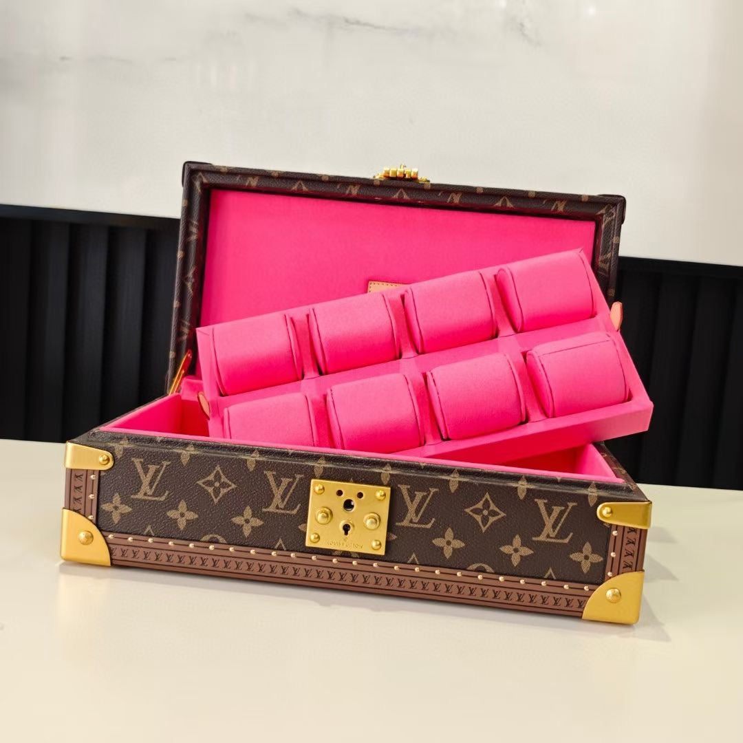 Louis Vuitton monogram trunk bag open with bright pink padded organizer and front clasp