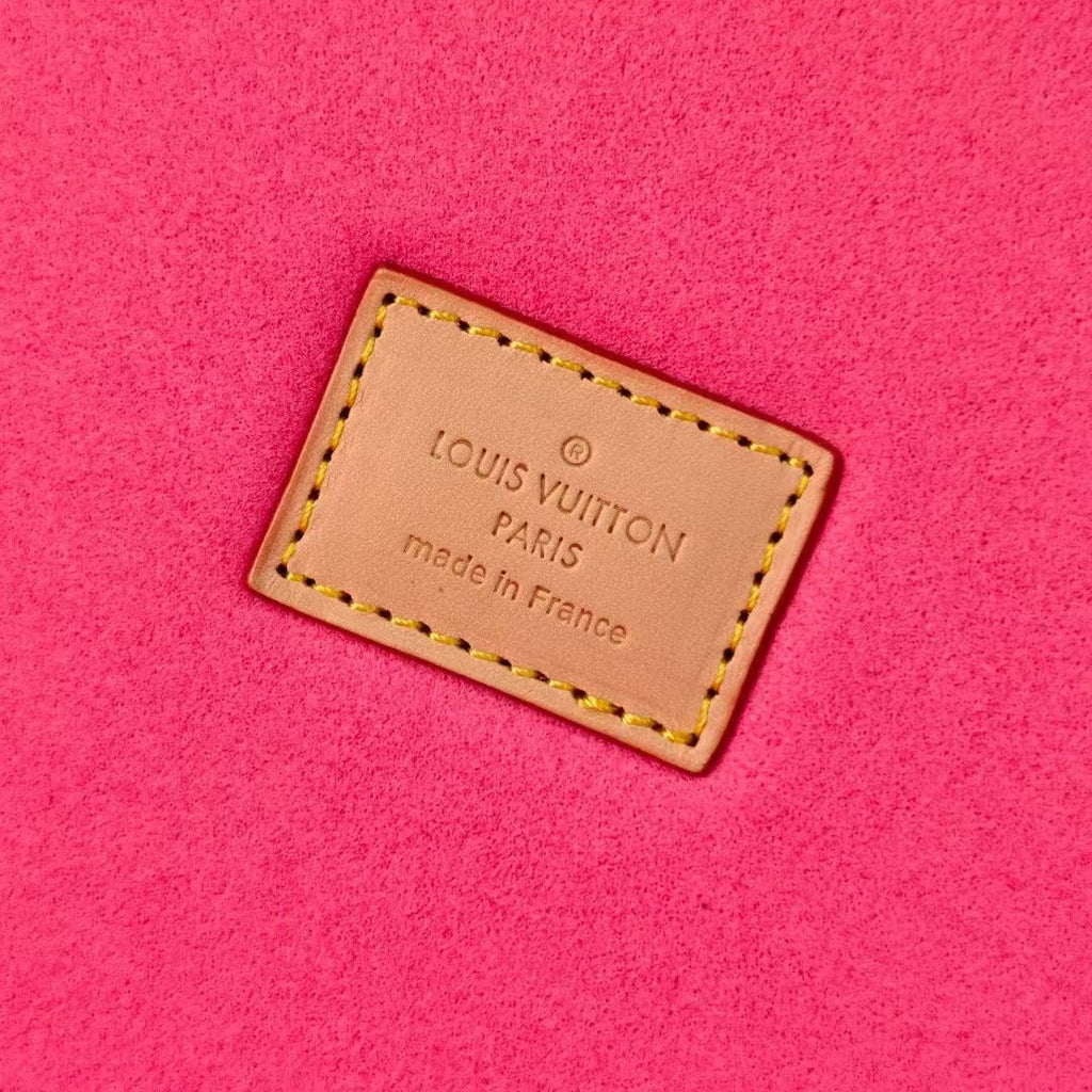 Louis Vuitton Paris France leather label on bright pink lining