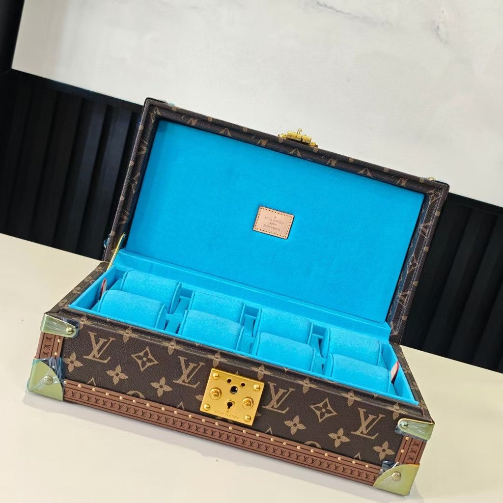 Louis Vuitton monogram trunk with blue interior, open lid and gold lock hardware