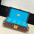 Louis Vuitton monogram trunk with blue interior, open lid and gold lock hardware