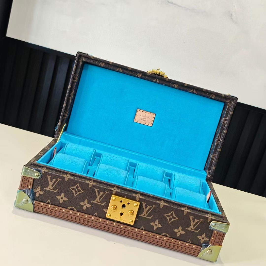 Louis Vuitton monogram trunk with blue interior, open lid and gold lock hardware