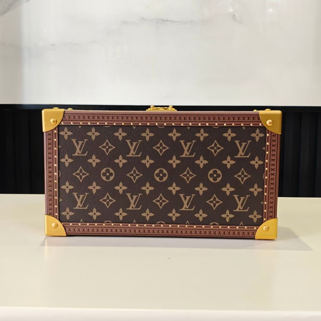 Louis Vuitton monogram trunk case, front view with gold corner fittings and clasp
