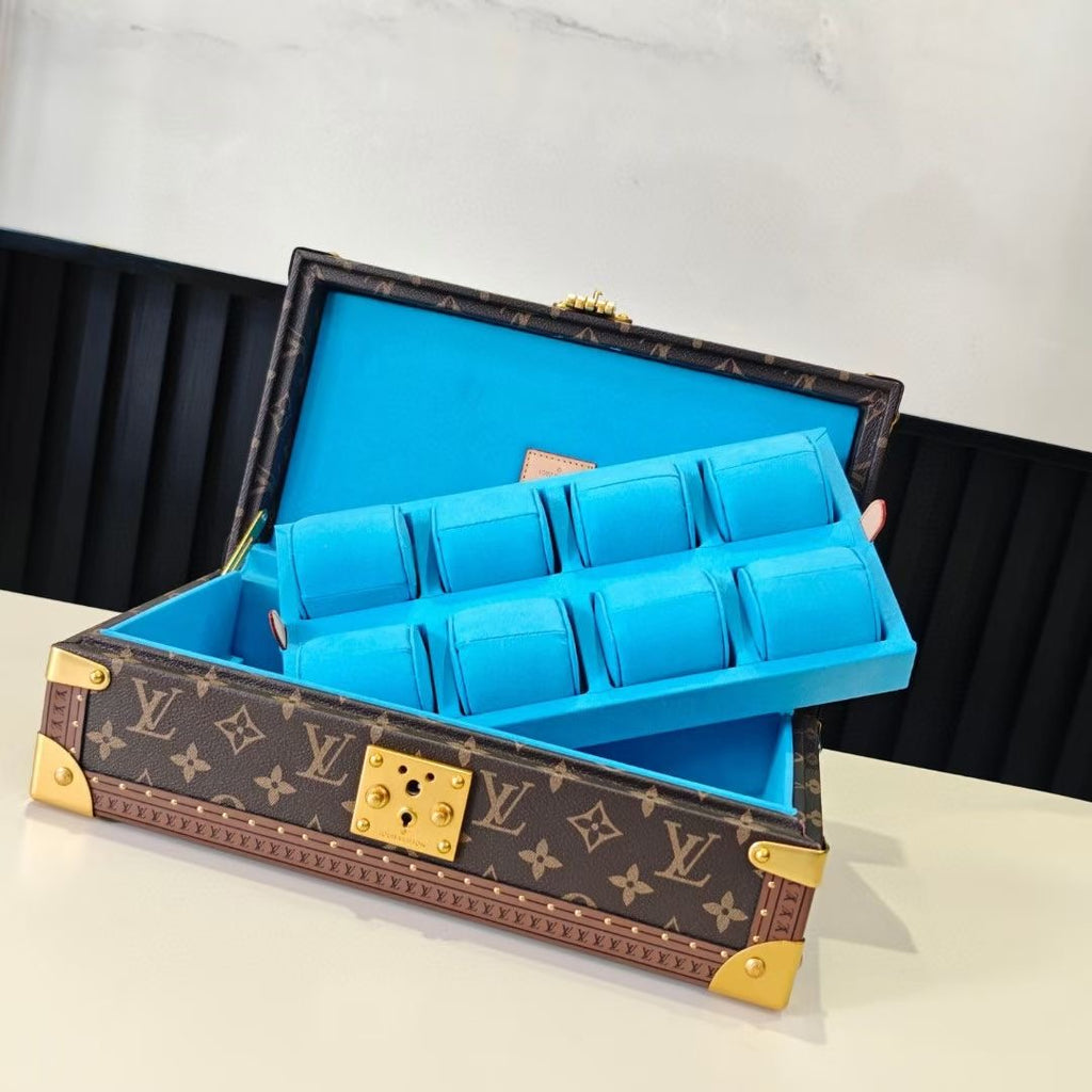 Louis Vuitton monogram trunk open with blue organizer insert and gold center latch