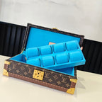 Louis Vuitton monogram trunk open with blue organizer insert and gold center latch