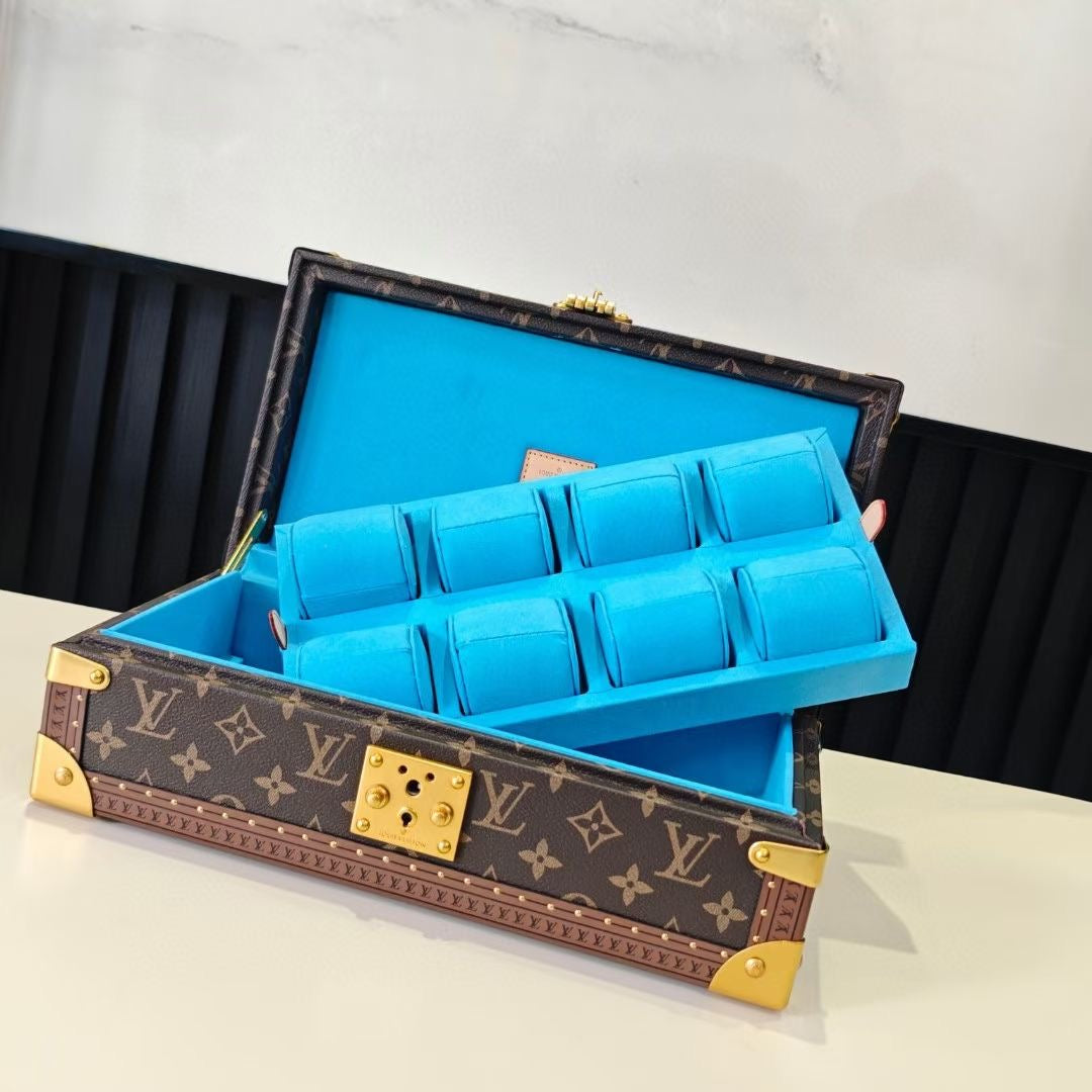 Louis Vuitton monogram trunk open with blue organizer insert and gold center latch