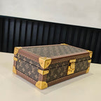 Louis Vuitton monogram trunk case in brown, closed with gold corner caps and clasp