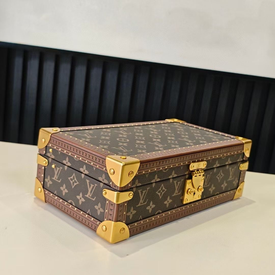 Louis Vuitton monogram trunk case in brown, closed with gold corner caps and clasp