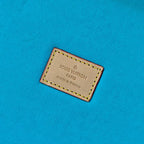 Louis Vuitton label on blue lining reading “Paris” and “Made in France”