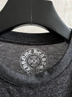 Long-sleeve T-shirt neckline with white circular logo print at the collar