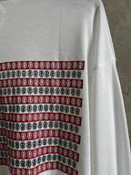 Back of white long-sleeve shirt with horizontal striped graphic band across upper back.