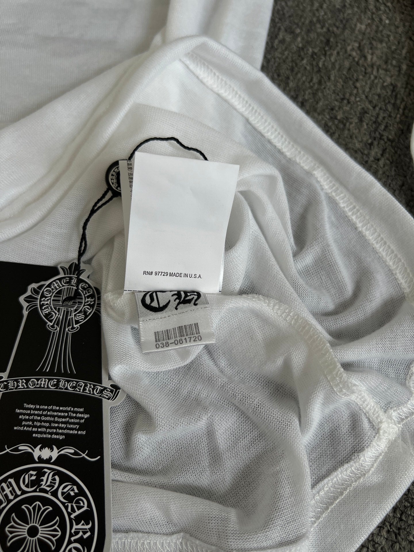 White long-sleeve top, interior neck label and hang tag